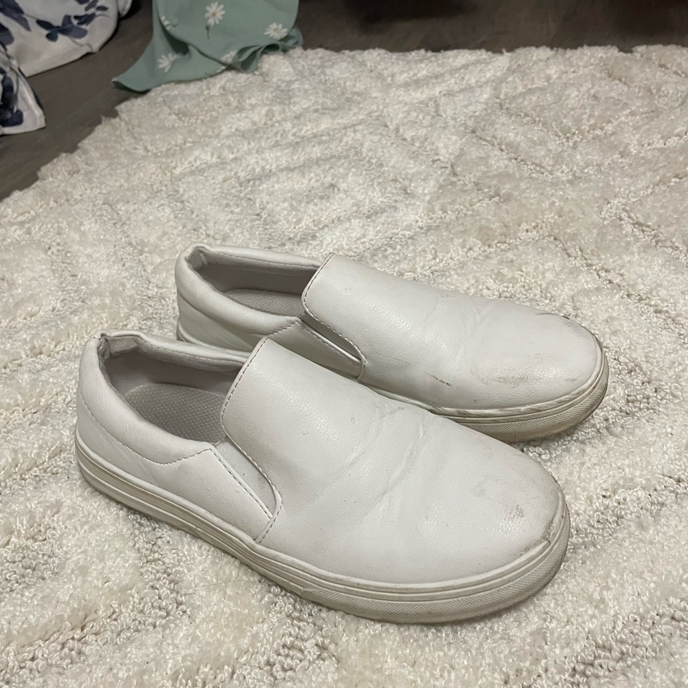 Used white sneakers